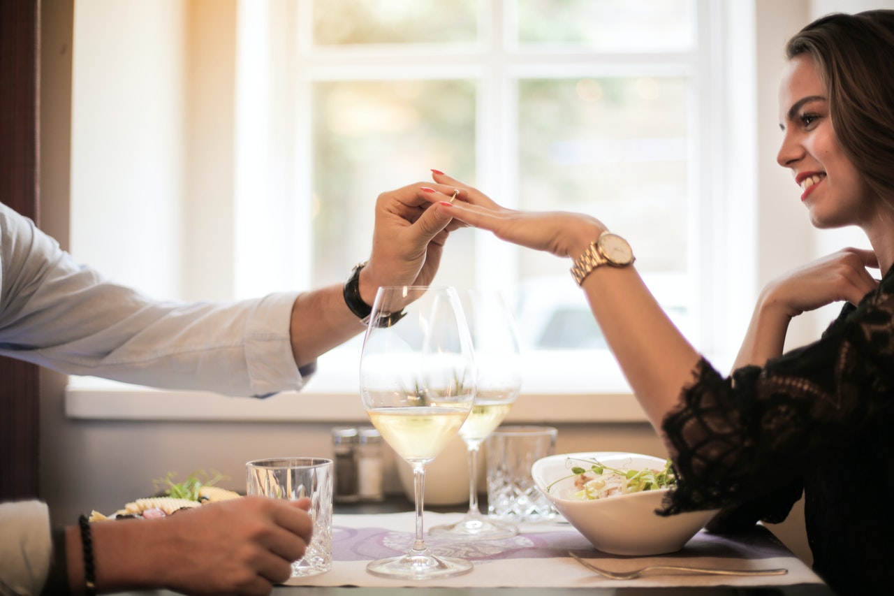 A lady receiving a ring with Argyle pink diamonds from her dear husband